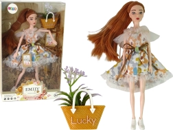 păpușă Emily în rochie florală cu accesoriu de toamnă