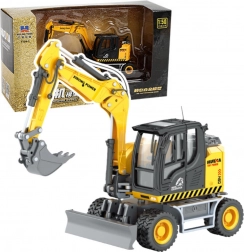 Model metalic excavator pe roți cu lamă HUINA 1:50