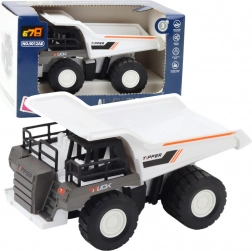 Basculantă de construcții cu piese metalice și motor albă