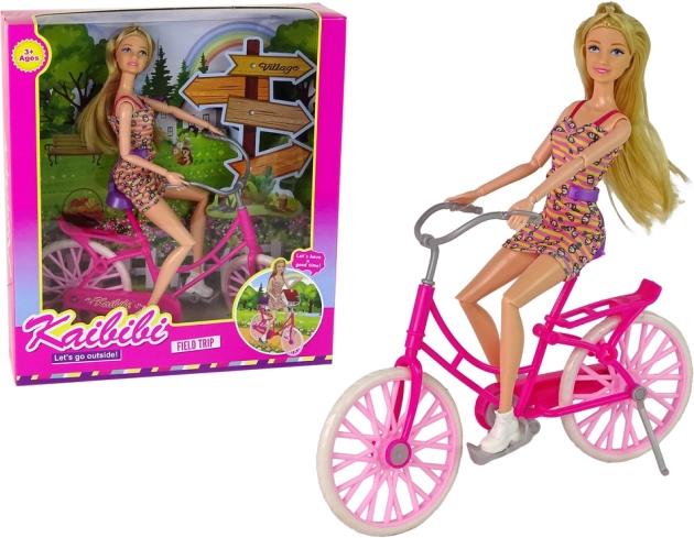 Păpușă pe bicicletă roz