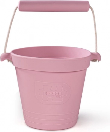 Găleată de plajă din silicon roz deschis BIGJIGS TOYS
