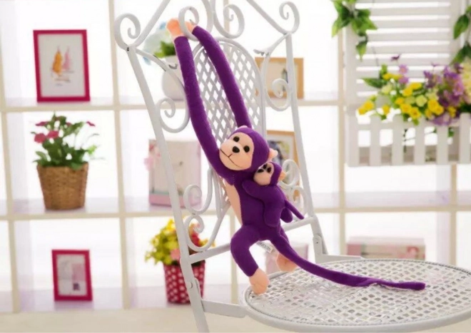 Maimuță violet de pluș cu pui