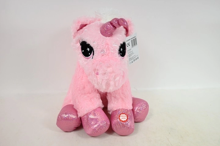 Unicorn de pluș șezând cu sunet