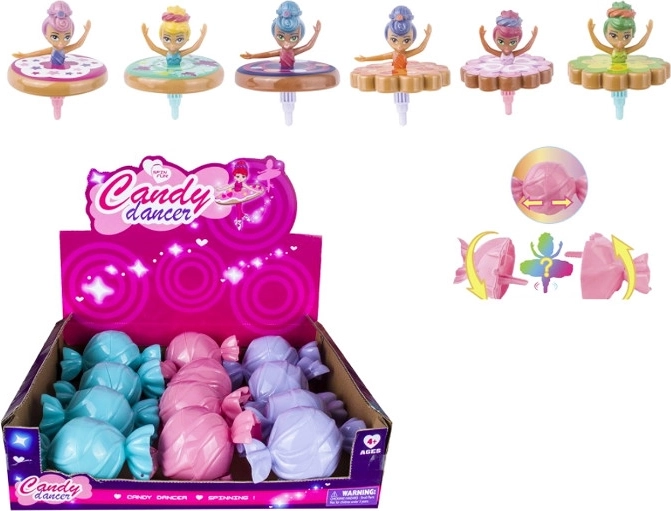 Păpușă balerină care se rotește ca un titirez, în ambalaj cadou în formă de bomboană