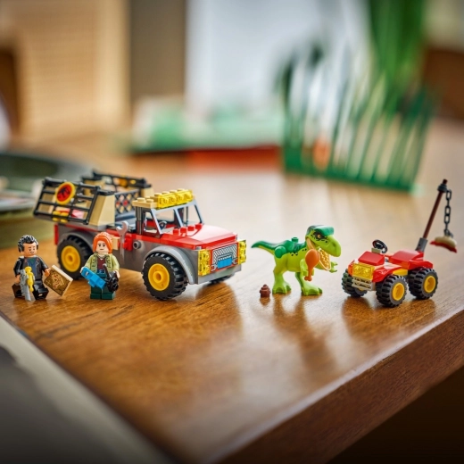 Prindeți puiul de T. rex și transportați-l în siguranță