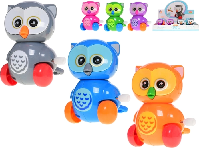 Bufniță veselă din plastic cu mecanism cu cheiță pentru copii