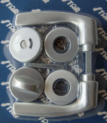 Feronerie cu rozete pentru uși MONET WC, elox argintiu