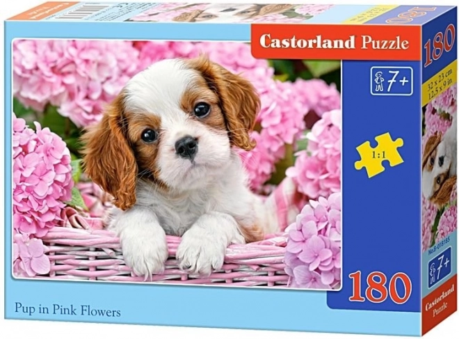 Puzzle cățel printre flori roz