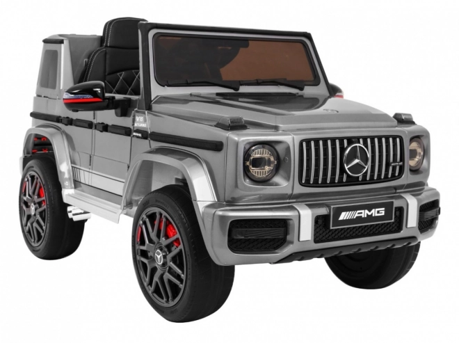 Mercedes AMG G63 pentru copii Vopsea argintie + telecomandă + MP3 LED + start lent + EVA + centuri
