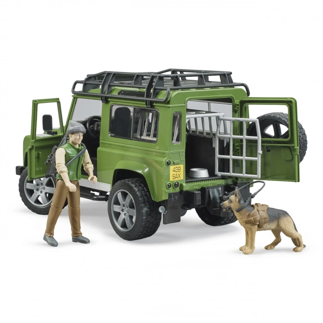 Land Rover Defender cu figurina vânător, câine și accesorii