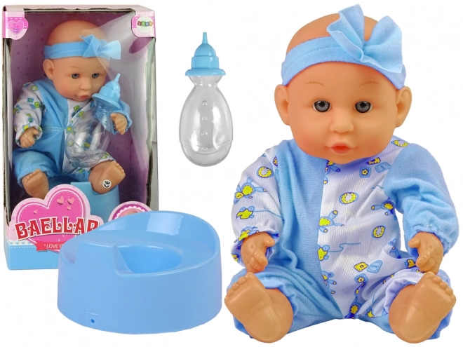 Păpușă bebeluș cu oliță și bandă cu fundiță 24 cm