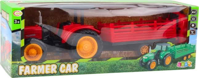Tractor agricol roșu controlat de la distanță cu remorcă