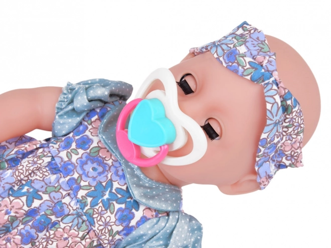 Lăbilă de gumă bebeluș cu accesorii care bea și face pipi