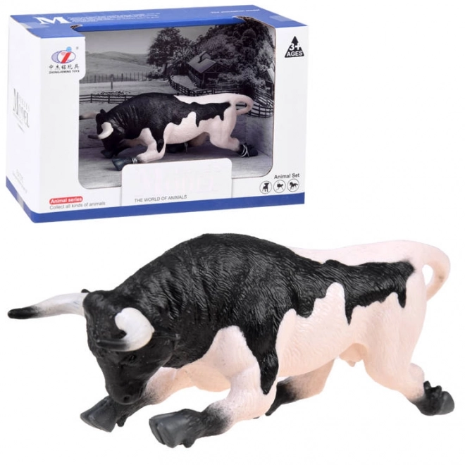 Figurină taur alb-negru gata de atac