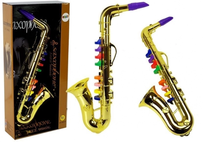 Saxofon de jucărie auriu