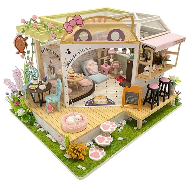 Miniatura căsuței cafenea pisicilor cu grădină