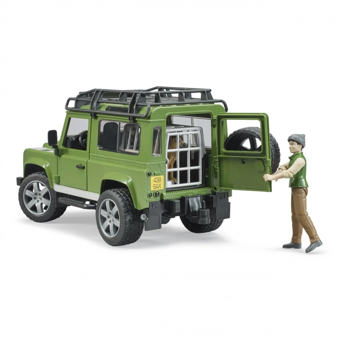 Land Rover Defender cu figurina vânător, câine și accesorii