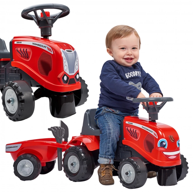 Tractorul Baby Mac Cormick roșu cu remorcă