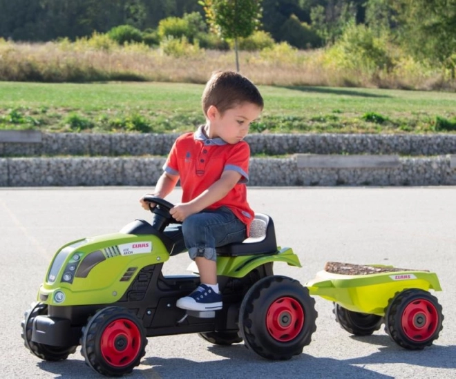 Tractor cu pedale Claas verde cu remorcă