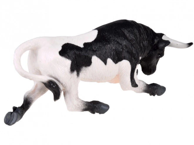 Figurină taur alb-negru gata de atac