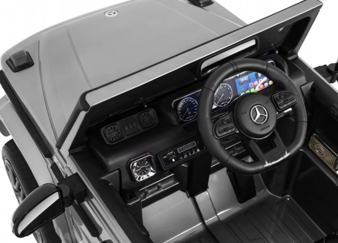 Mercedes AMG G63 pentru copii Vopsea argintie + telecomandă + MP3 LED + start lent + EVA + centuri