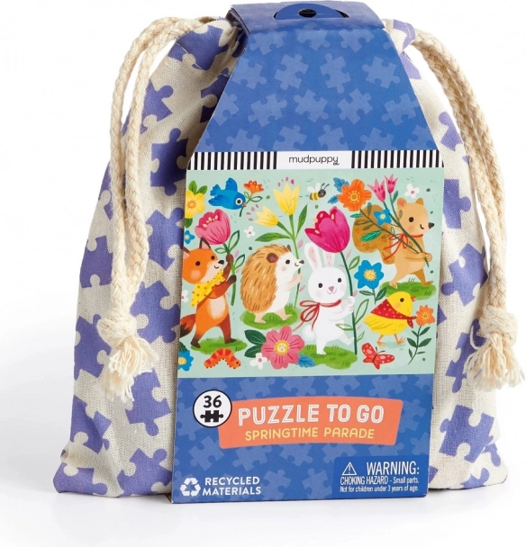 Puzzle Parada de primăvară în săculeț de pânză de la Mudpuppy