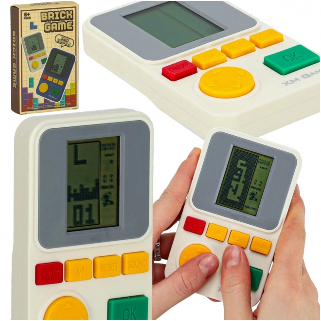 Consolă portabilă electronică pentru jocuri de îndemânare albă