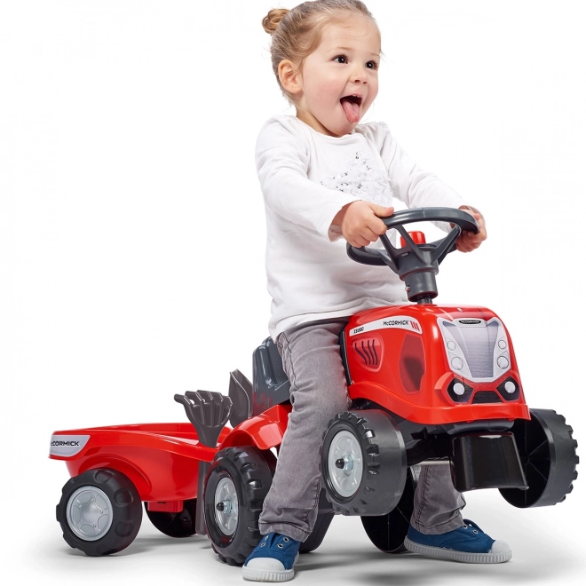 Tractorul Baby Mac Cormick roșu cu remorcă