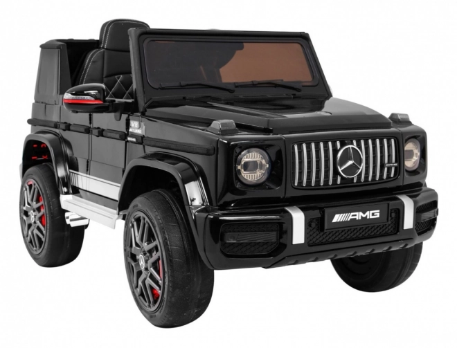 Mercedes AMG G63 pentru copii Lak negru + telecomandă + MP3 LED + pornire lentă + EVA + centuri