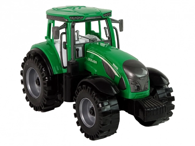 Tractor verde cu semănătoare detașabilă cu fricțiune