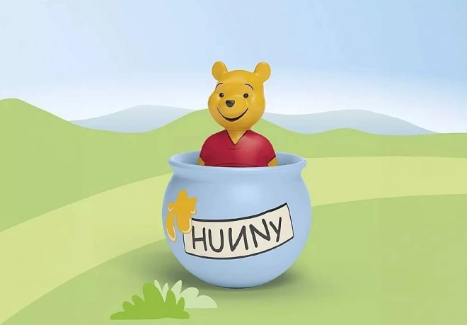 Figurină Junior Disney Oala cu miere a lui Winnie de Pluş