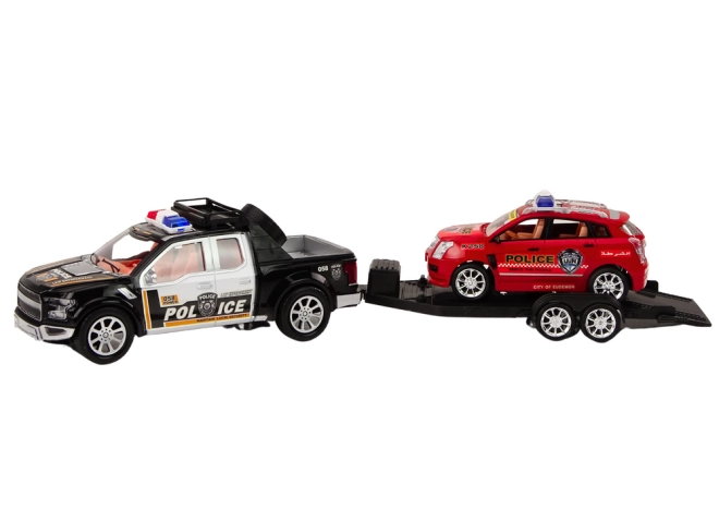 Două vehicule de poliție cu remorcă de tractare