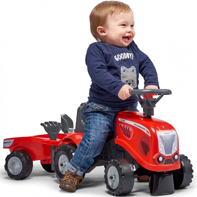 Tractorul Baby Mac Cormick roșu cu remorcă