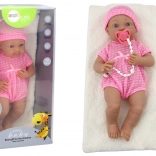 Păpușă bebeluș în hăinuță roz cu căciuliță, suzetă și păturică