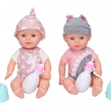 Bebeluș cu oliță și biberon